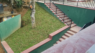 School courtyard with pink stairs - Ilukpitiya Madhya Maha Vidyalaya